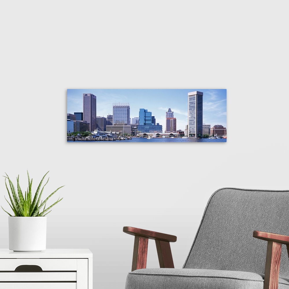A modern room featuring Buildings that sit on the inner harbor in Baltimore are photographed with a wide angle lens.