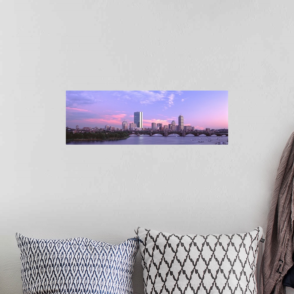 A bohemian room featuring Landscape photograph of the Boston skyline beneath a vibrant sky at dusk, the Longfellow Bridge o...