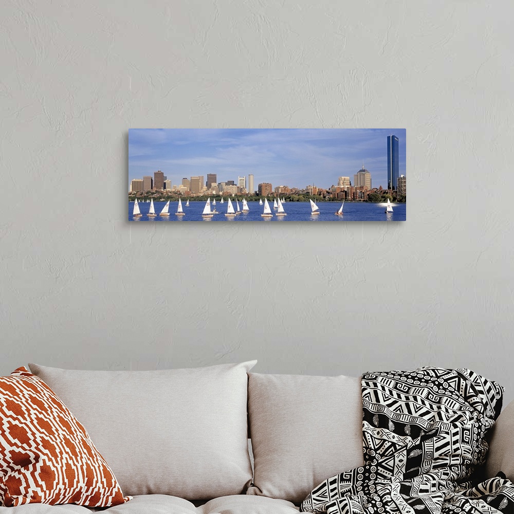 A bohemian room featuring Giant landscape photograph of many sailboats in the Charles River, the Boston skyline in the back...