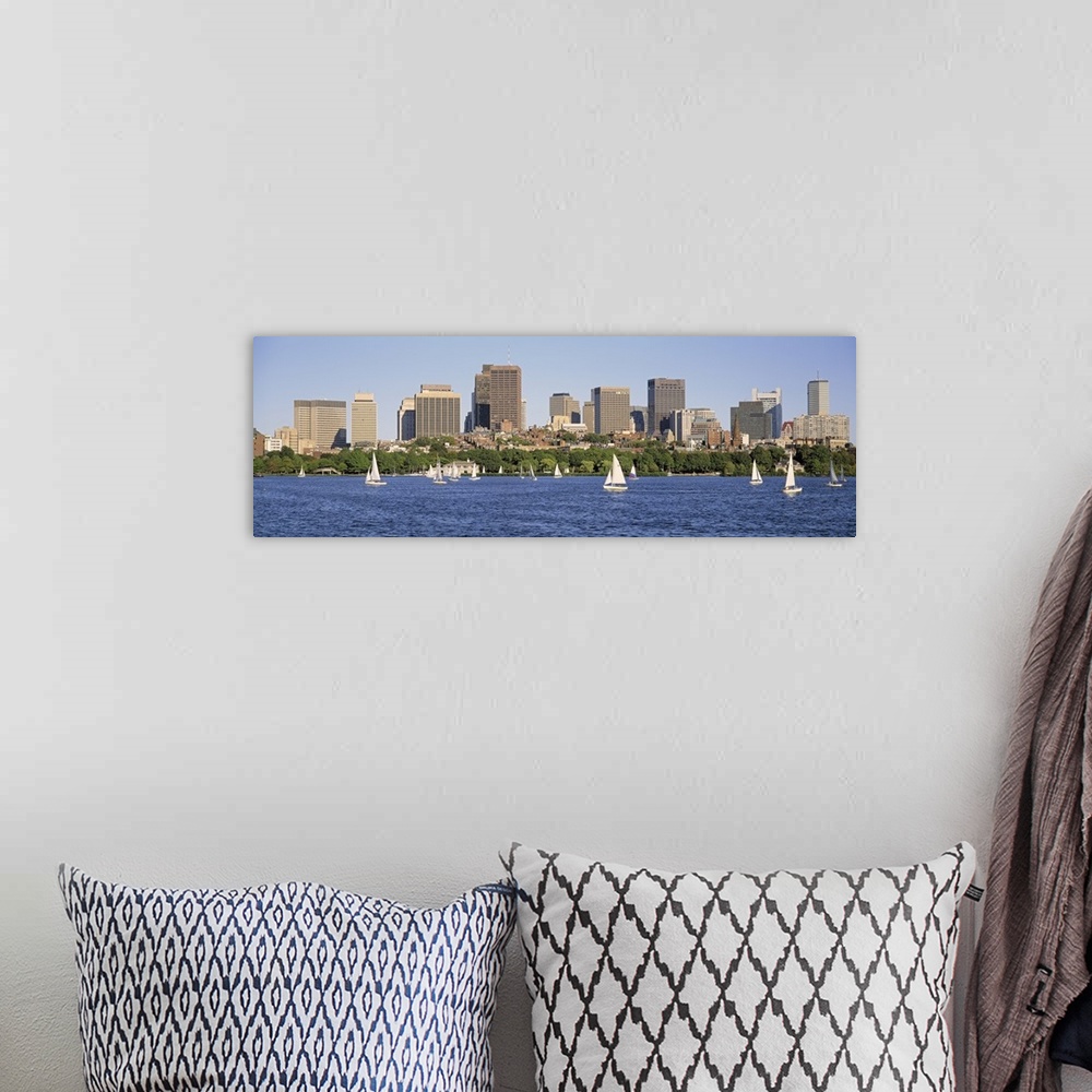 A bohemian room featuring Panoramic photograph of skyscrapers filling the horizon in a busy city.  Within the bay in the fo...