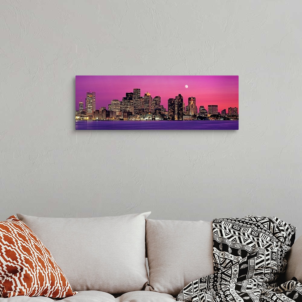 A bohemian room featuring Panoramic photograph of a skyline in Boston, Massachusetts at night by the shore.  The moon in th...