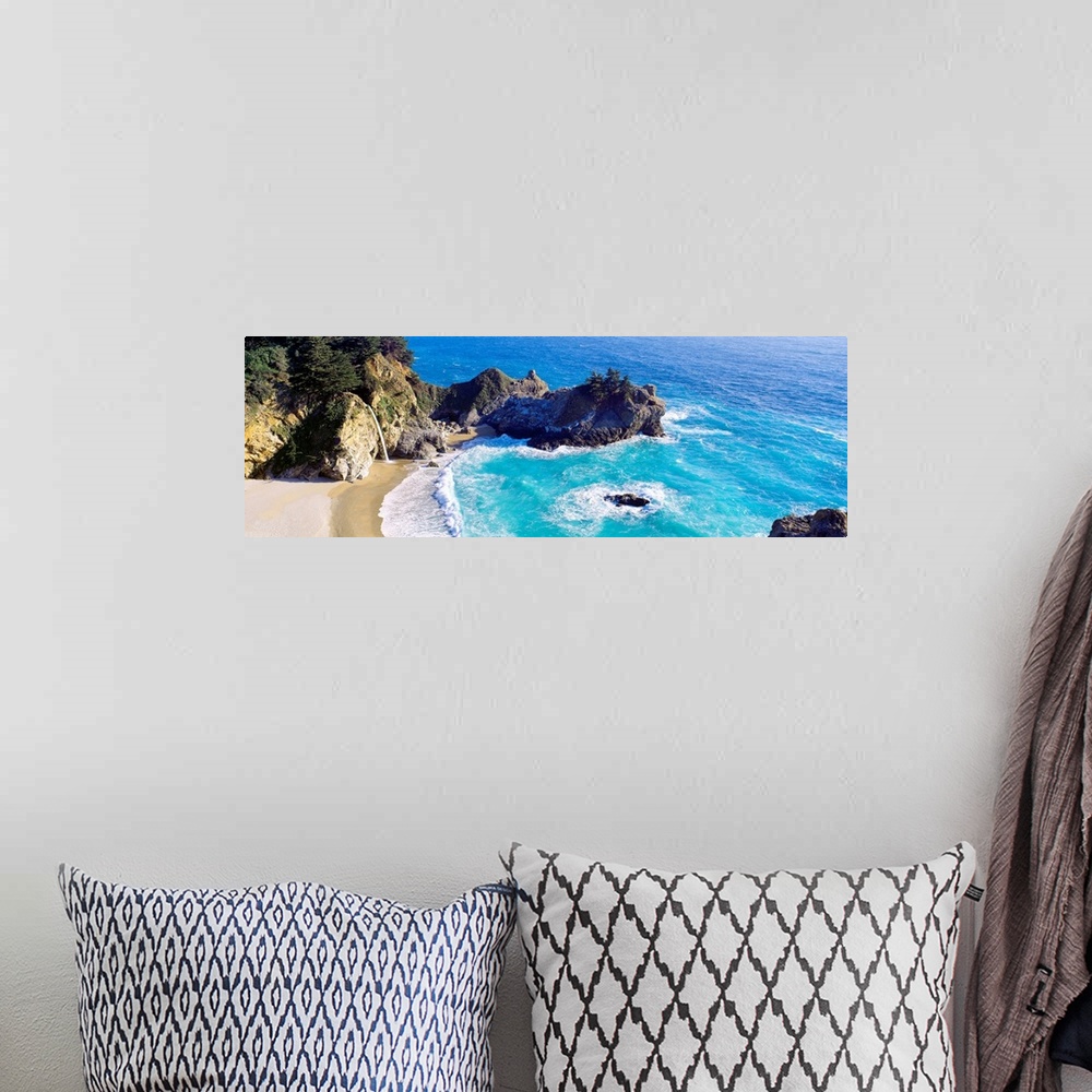 A bohemian room featuring Panoramic photograph of waves from the Pacific ocean crashing into the jagged rocks within McWay ...