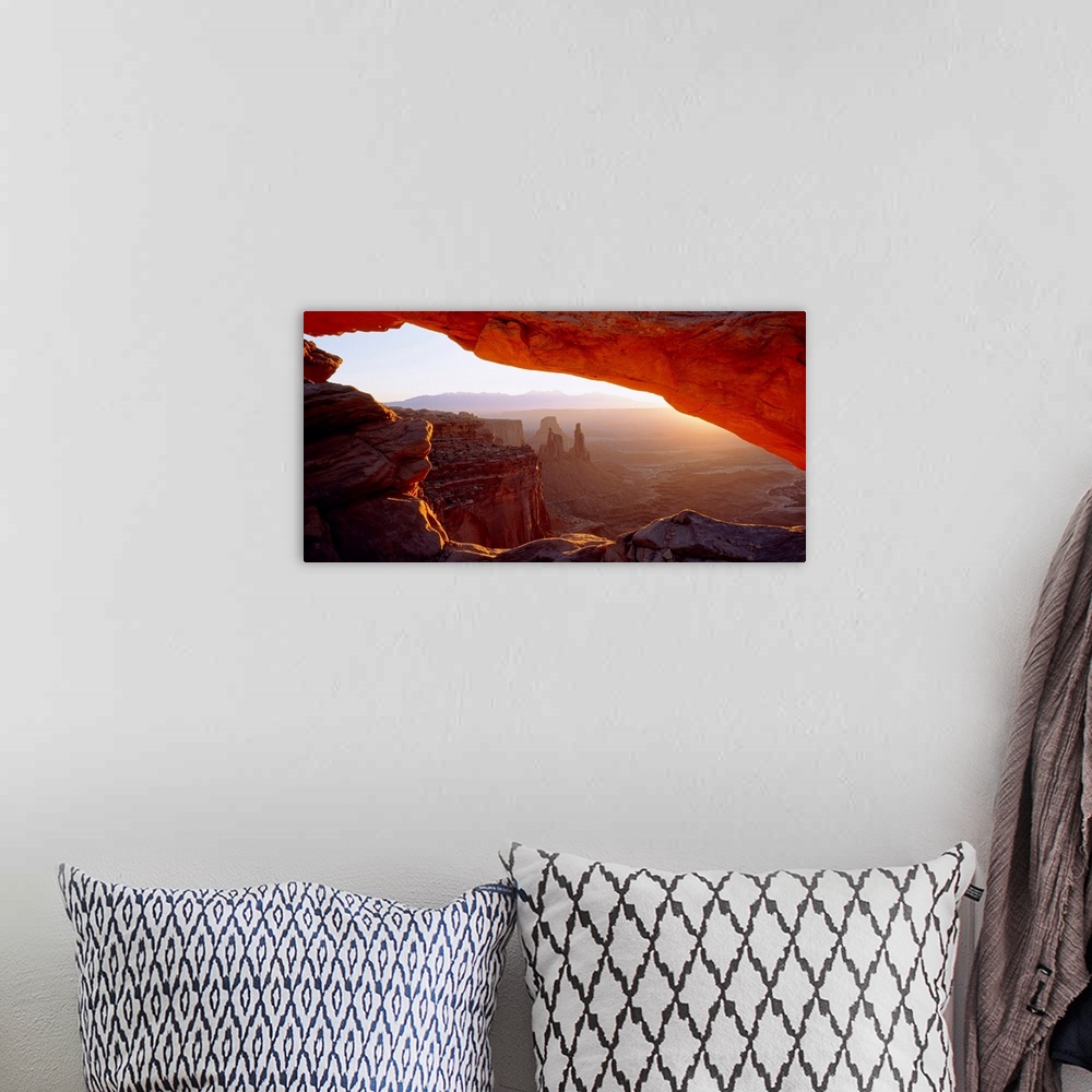 A bohemian room featuring Wall art for the home or office this big picture shows a view of the desert at sunrise through a ...