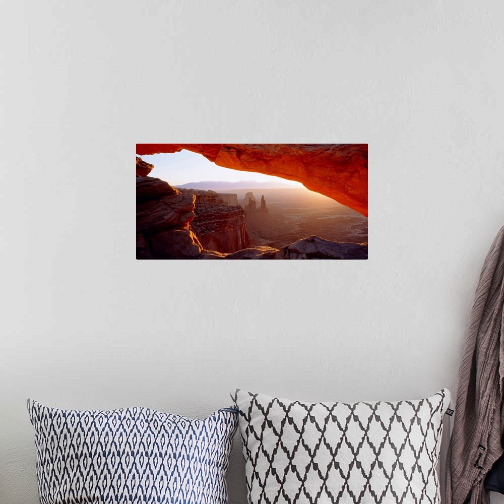A bohemian room featuring Wall art for the home or office this big picture shows a view of the desert at sunrise through a ...