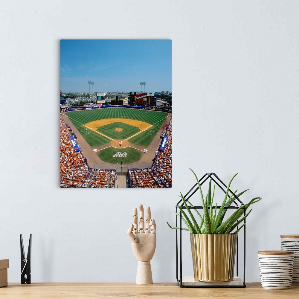 A bohemian room featuring Vertical, aerial photograph of Shea Stadium, full of fans during a New York Mets baseball game.