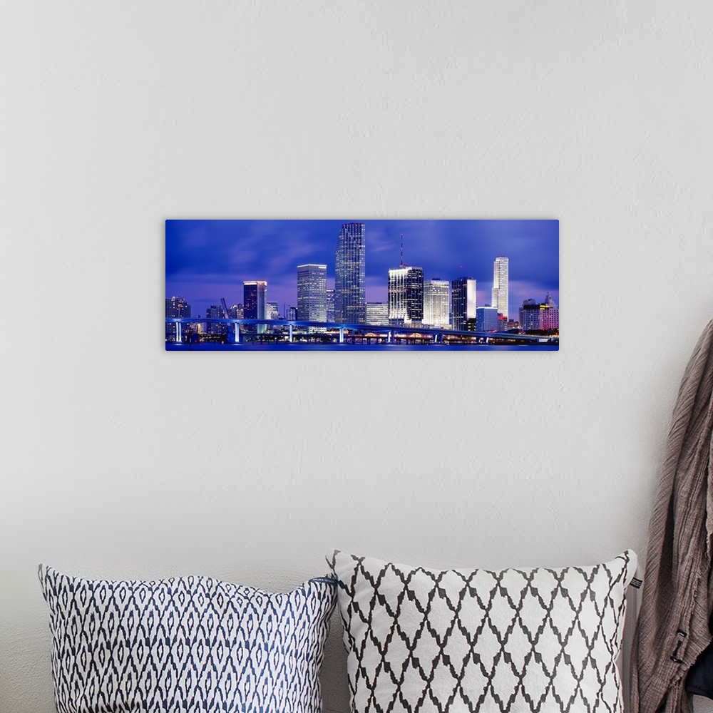 A bohemian room featuring Big panoramic canvas photo of a cityscape on the water with a long bridge passing in front from r...