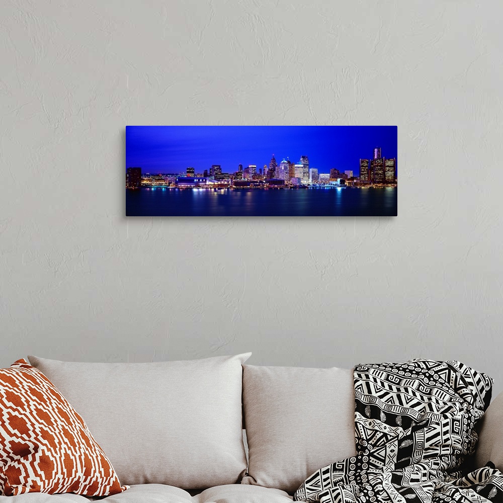 A bohemian room featuring Night view of Detroit's downtown skyline.