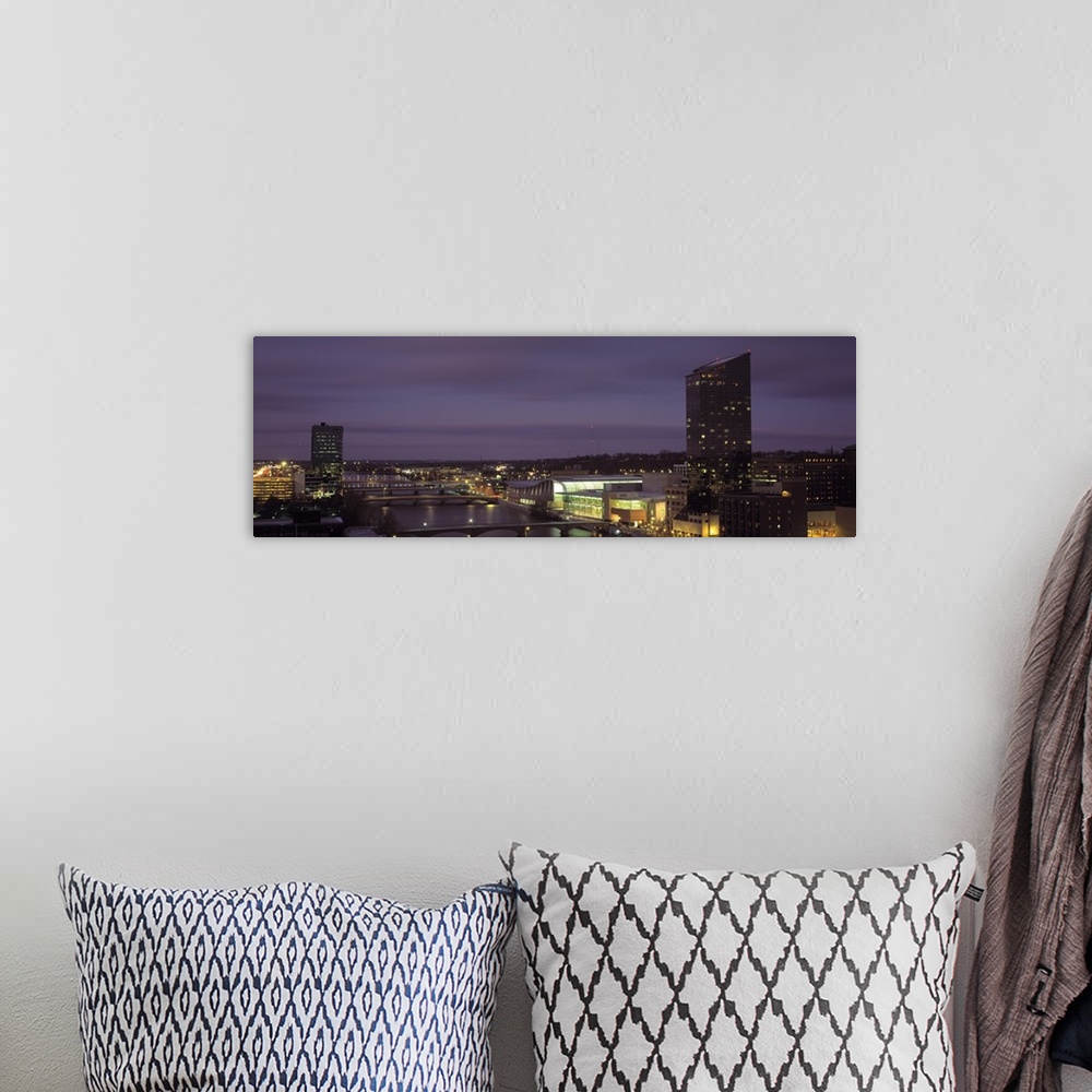A bohemian room featuring Night panoramic of the city of Grand Rapids, Michigan.