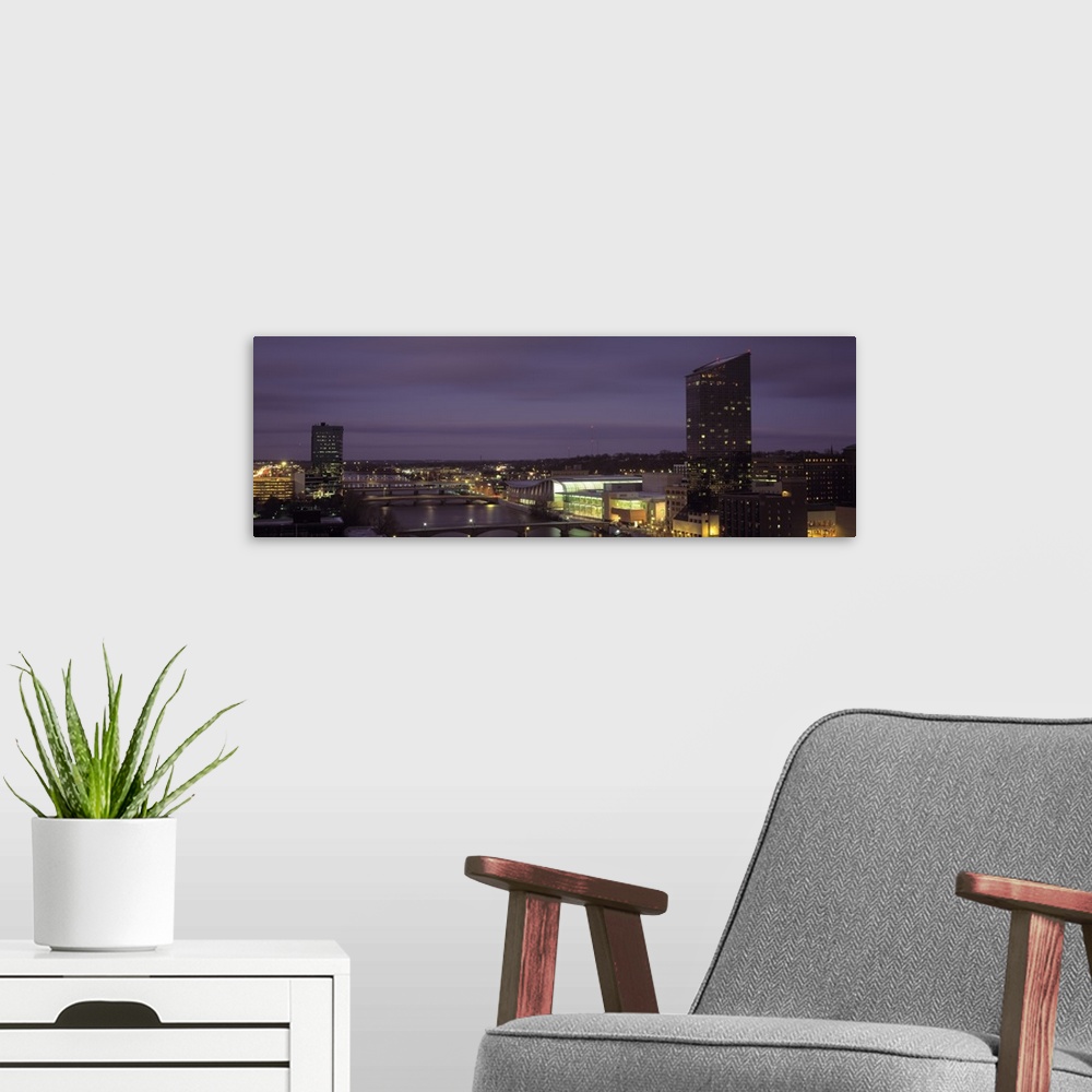 A modern room featuring Night panoramic of the city of Grand Rapids, Michigan.