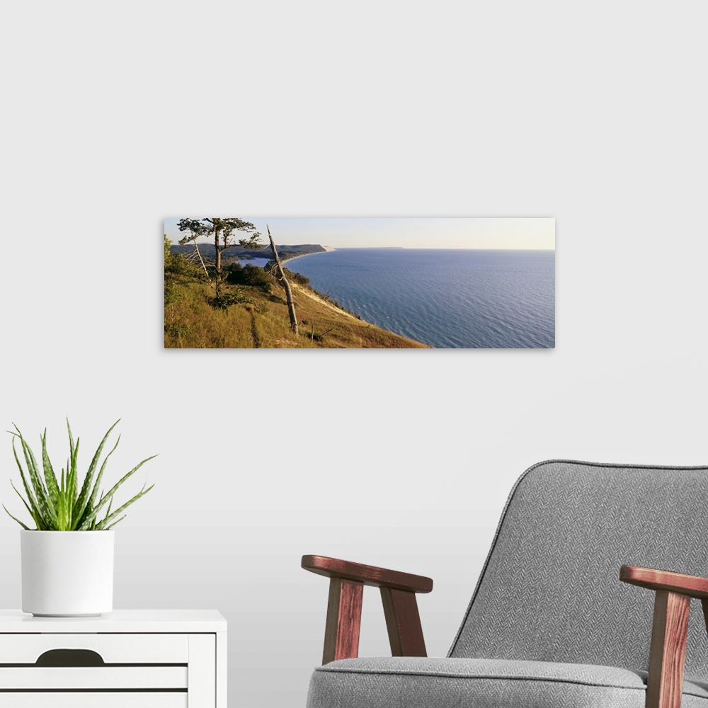 A modern room featuring Panoramic photograph taken of a national park in Michigan with a vast view of Lake Michigan to th...