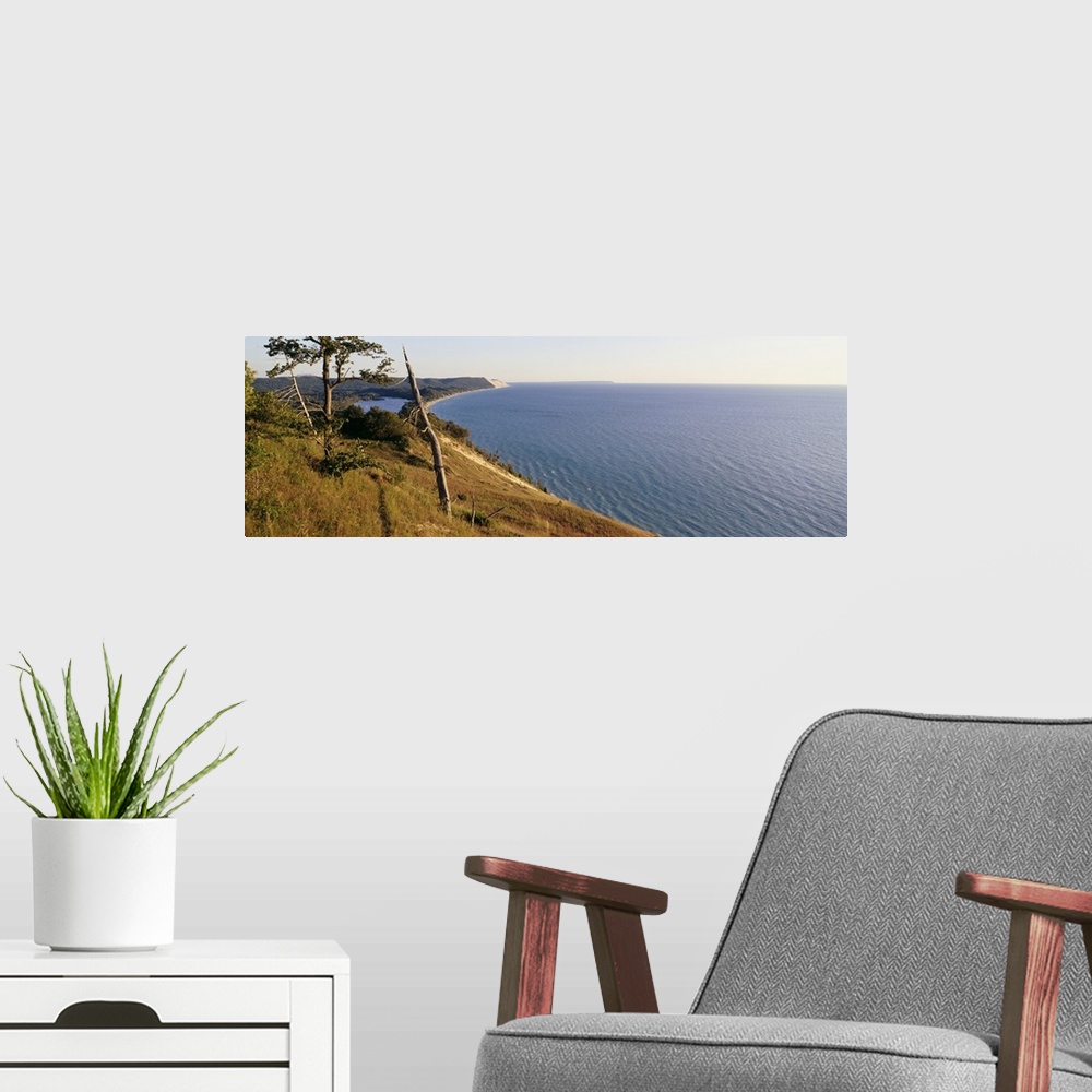 A modern room featuring Panoramic photograph taken of a national park in Michigan with a vast view of Lake Michigan to th...