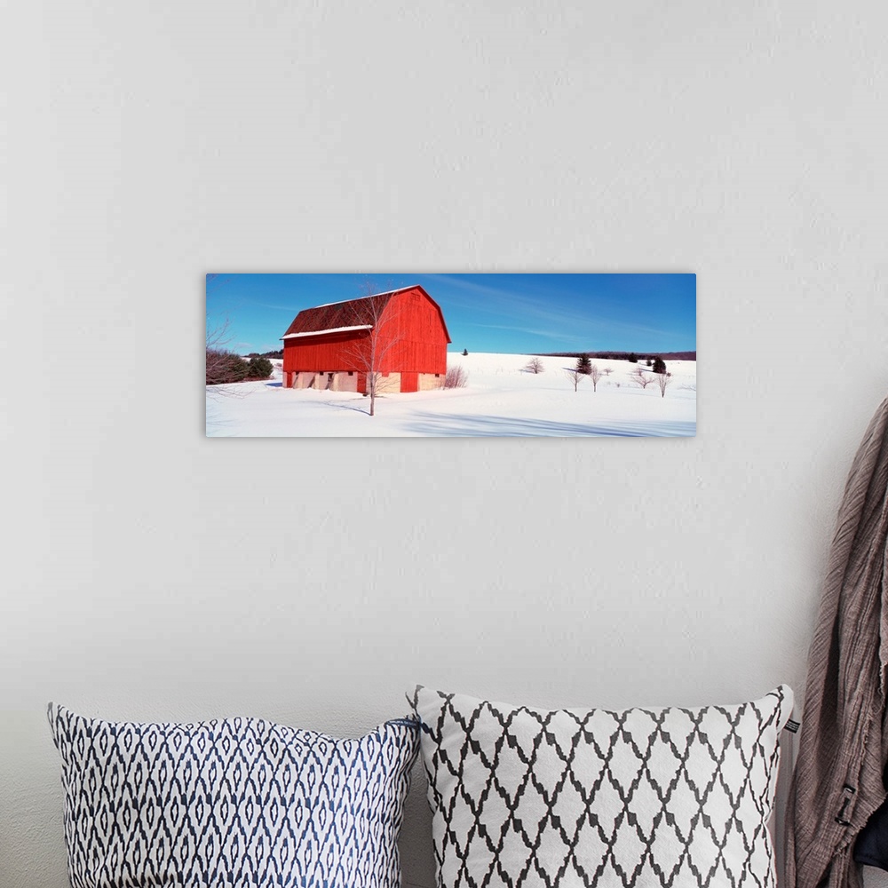 A bohemian room featuring Michigan, View of a red stable on a snow covered farm