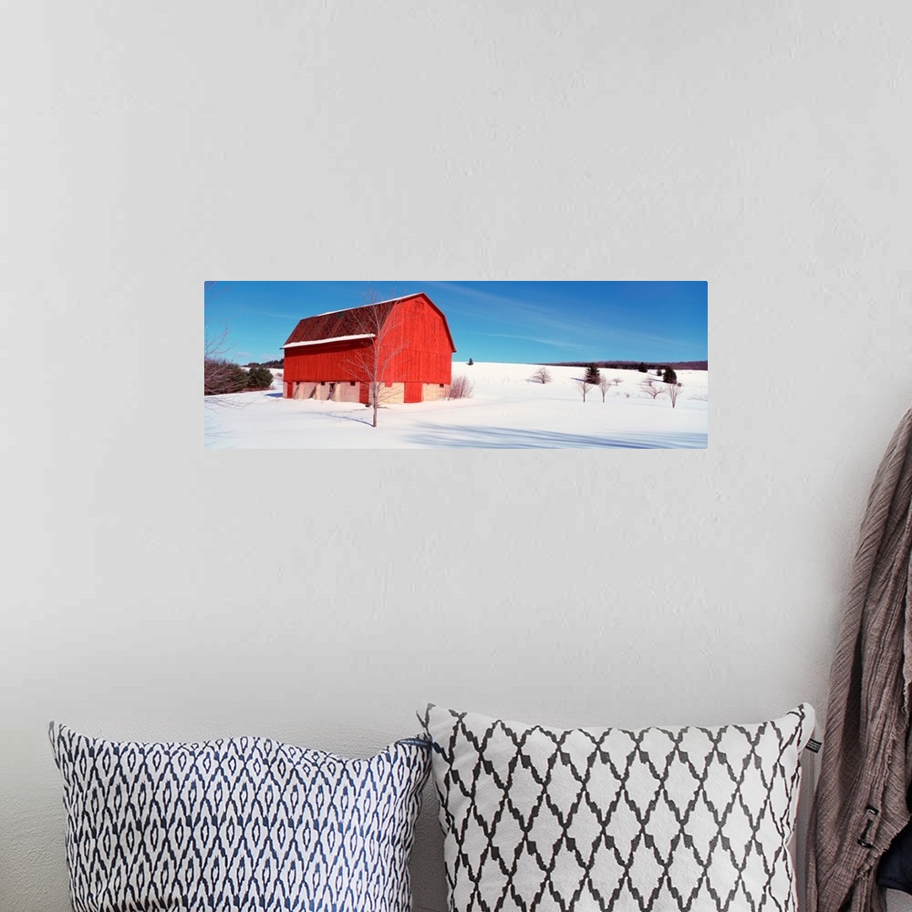 A bohemian room featuring Michigan, View of a red stable on a snow covered farm