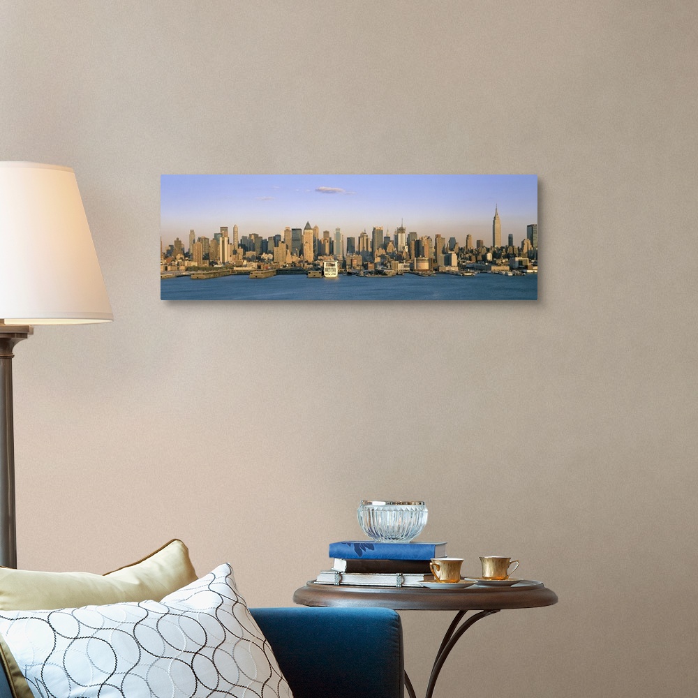 A traditional room featuring Long horizontal photo print of the NYC cityscape meeting the water.