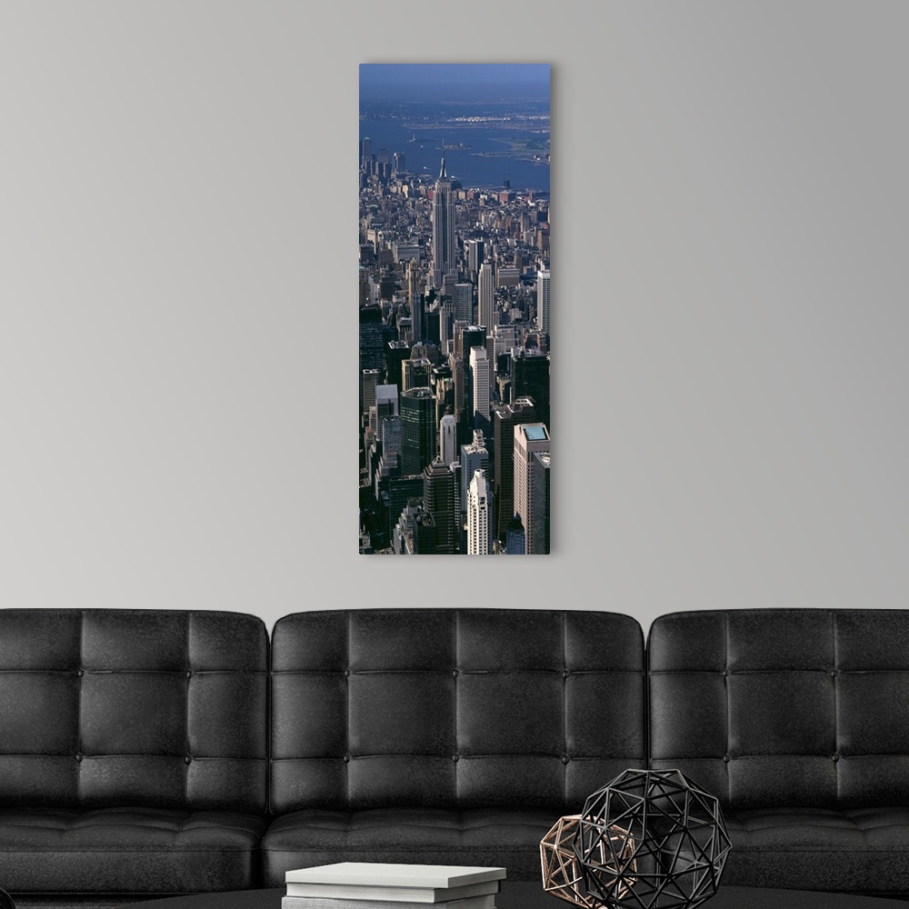 A modern room featuring Skyscrapers in New York City are photographed from an aerial view and in vertical orientation.