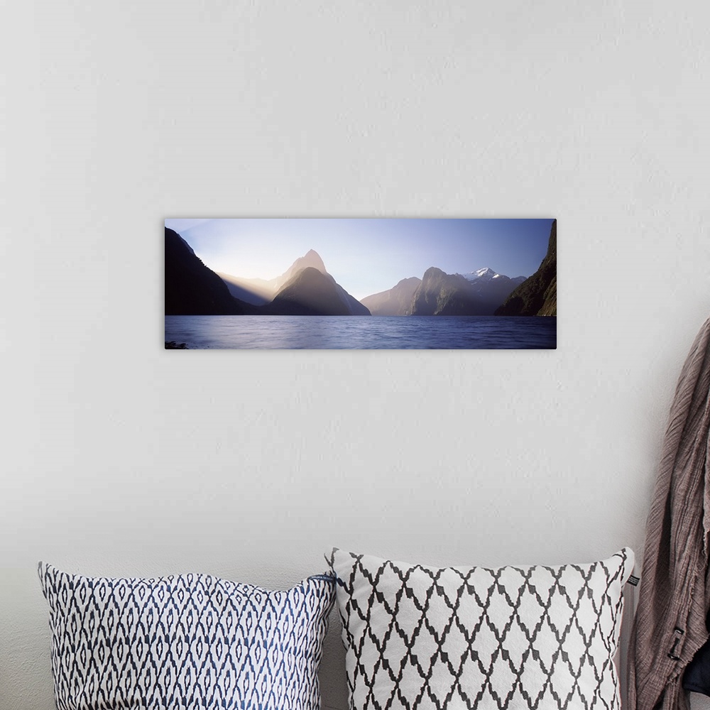 A bohemian room featuring Mountain range at water's edge, Milford Sound, Fiordland National Park, South Island, New Zealand