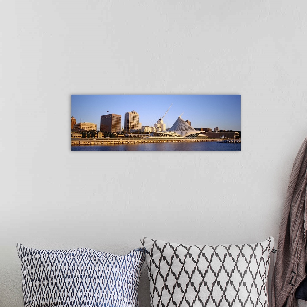 A bohemian room featuring Panoramic photograph on a big canvas of buildings on the water in Milwaukee, Wisconsin, including...