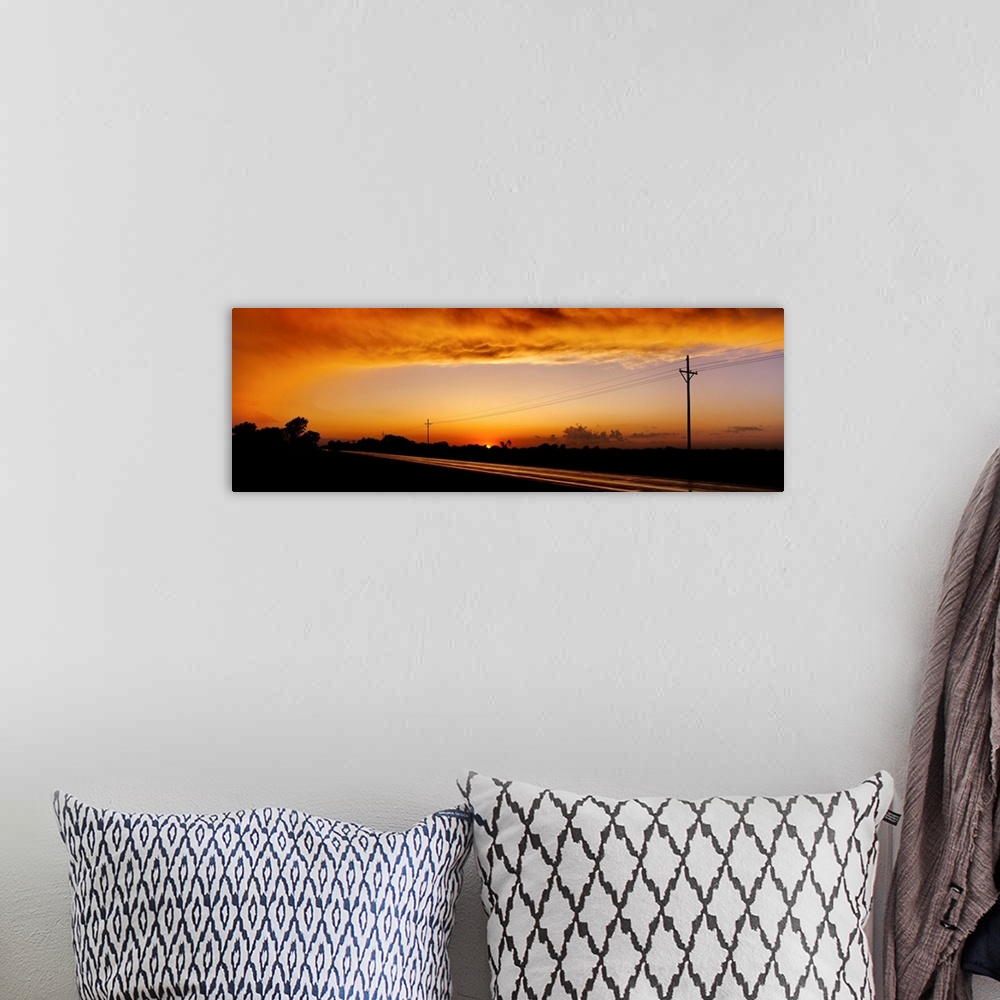 A bohemian room featuring Missouri, Riverton, Route 66, View of clouds over a highway at dusk