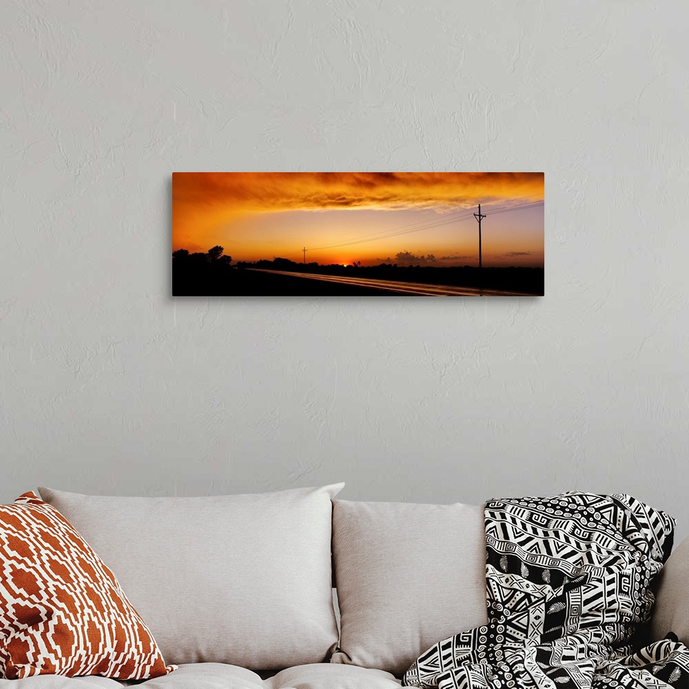 A bohemian room featuring Missouri, Riverton, Route 66, View of clouds over a highway at dusk