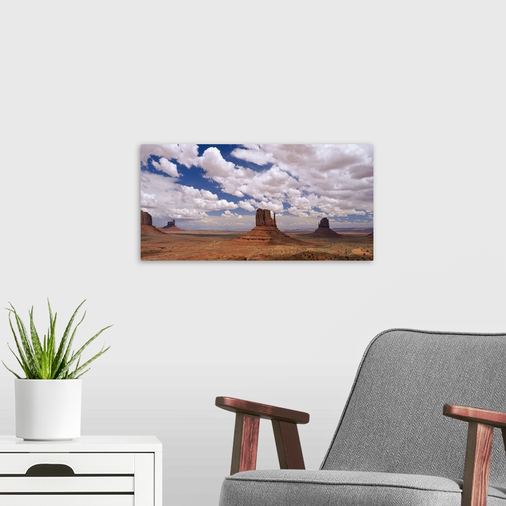 A modern room featuring Horizontal photo on canvas of rock monuments in a desert in Arizona.