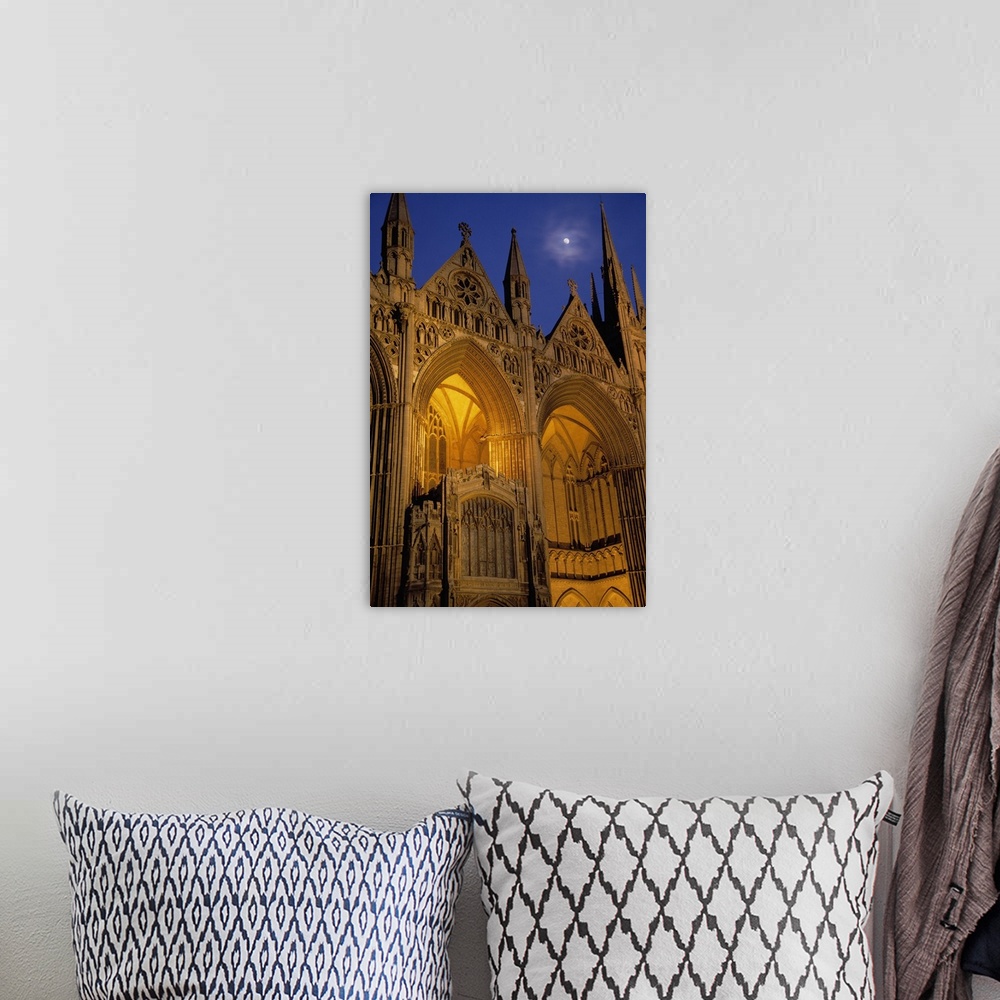 A bohemian room featuring Moon over Peterborough Cathedral illuminated at night, Peterborough, England.