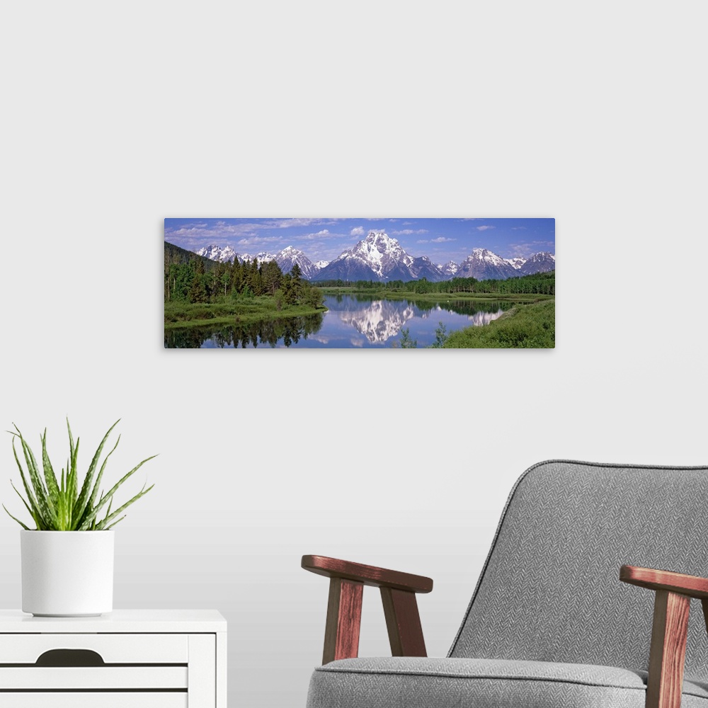 A modern room featuring Scenic panoramic photo of the Mount Moran Snake River in the Oxbow Bend in the Grand Teton Nation...