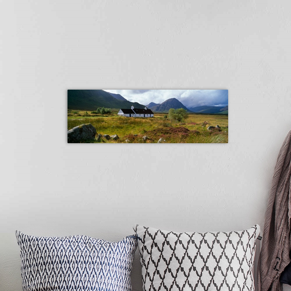 A bohemian room featuring Mountain landscape with Blackrock Cottage, autumn color, Glen Coe region, Scotland