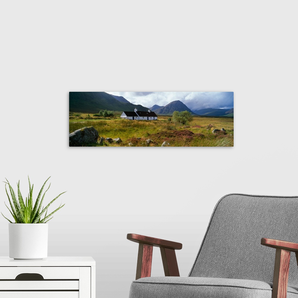 A modern room featuring Mountain landscape with Blackrock Cottage, autumn color, Glen Coe region, Scotland