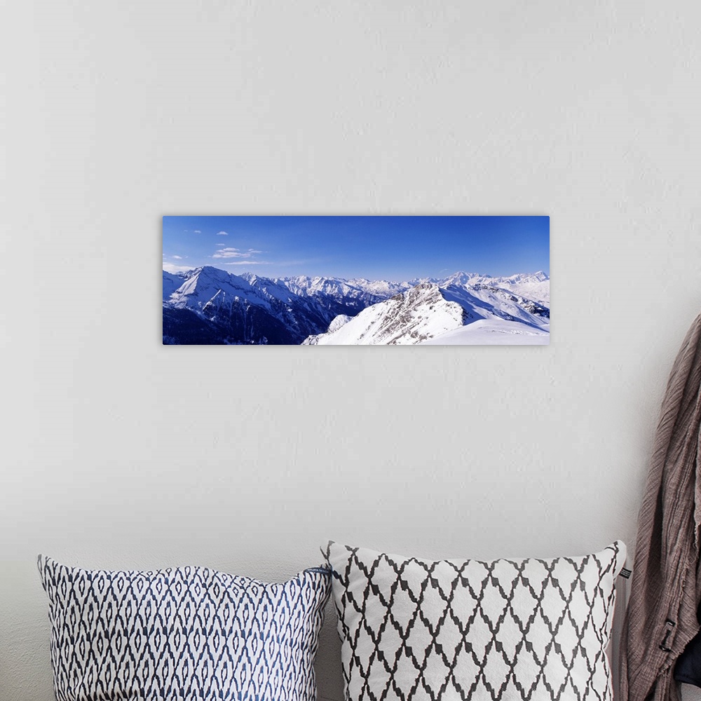 A bohemian room featuring Mountain range covered with snow, Valle DAosta, Italy