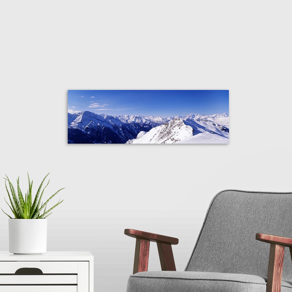 A modern room featuring Mountain range covered with snow, Valle DAosta, Italy