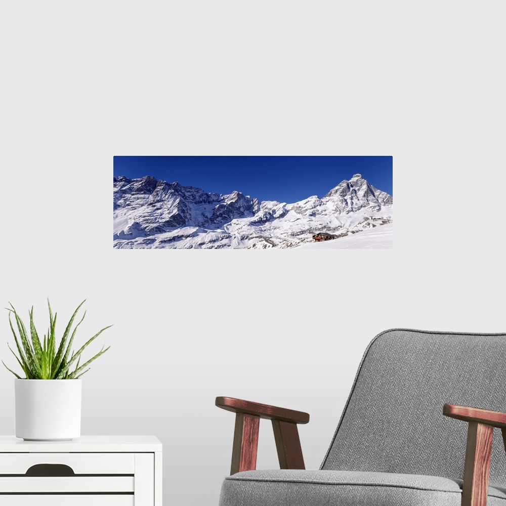 A modern room featuring Mountain range covered with snow, Valle DAosta, Italy
