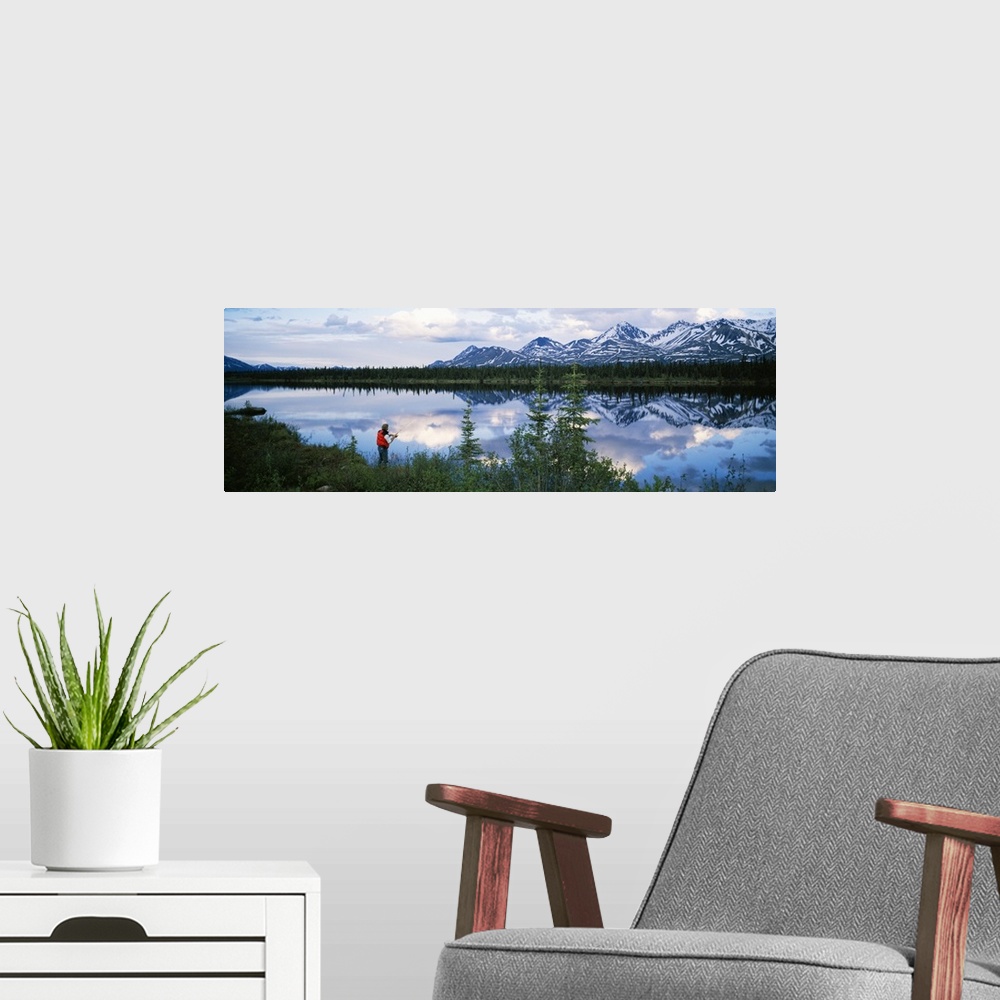 A modern room featuring Mountain scene with lake reflection, fisherman at water's edge, spring, Alaska Range, Alaska