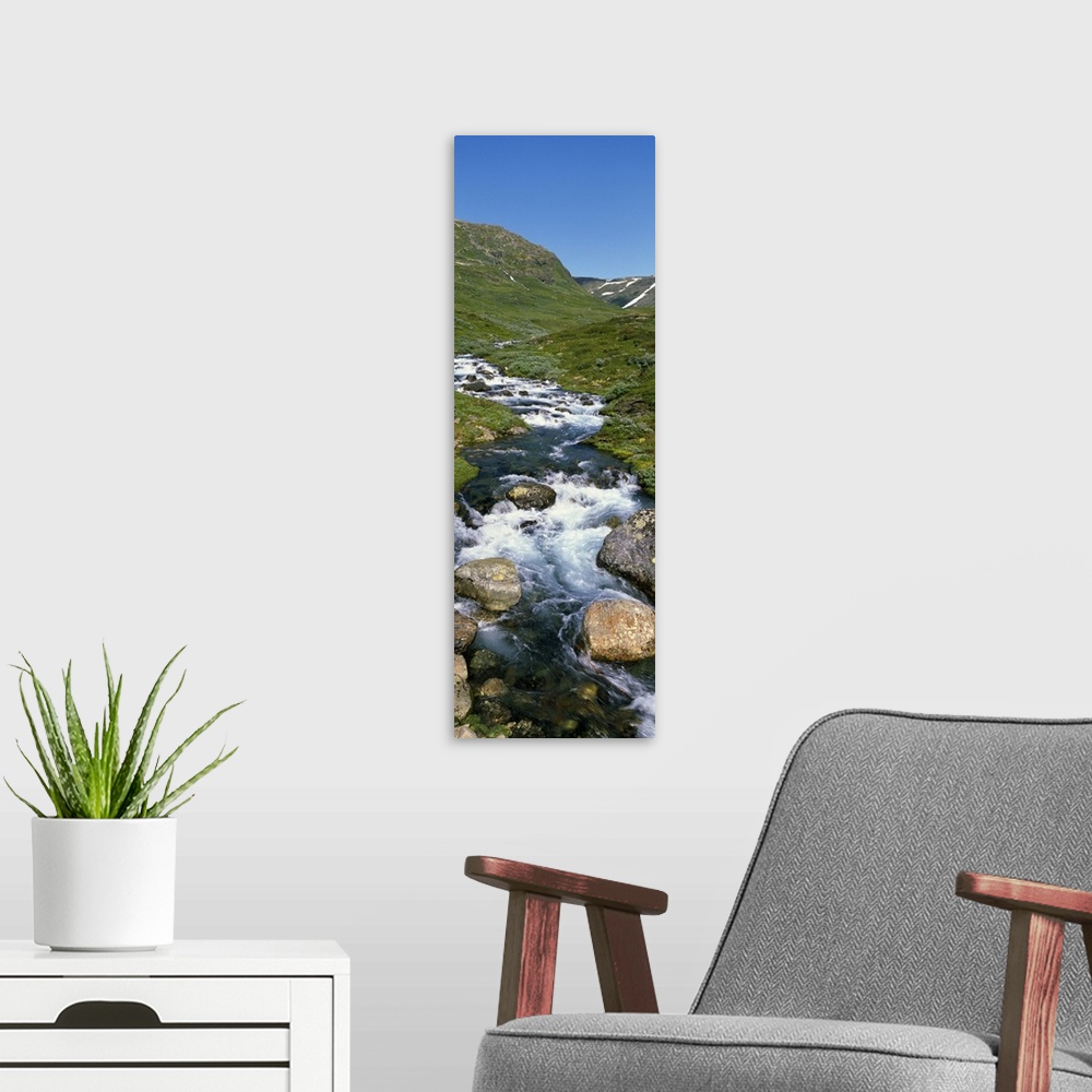 A modern room featuring Mountain stream over rocks, Norway