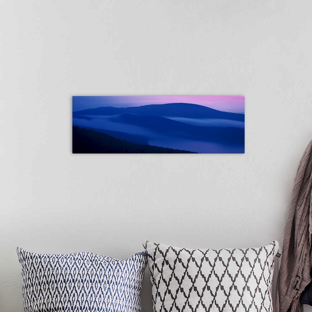 A bohemian room featuring Panoramic photograph on a big wall hanging of shadowed mountains at sunset at Acadia National Par...