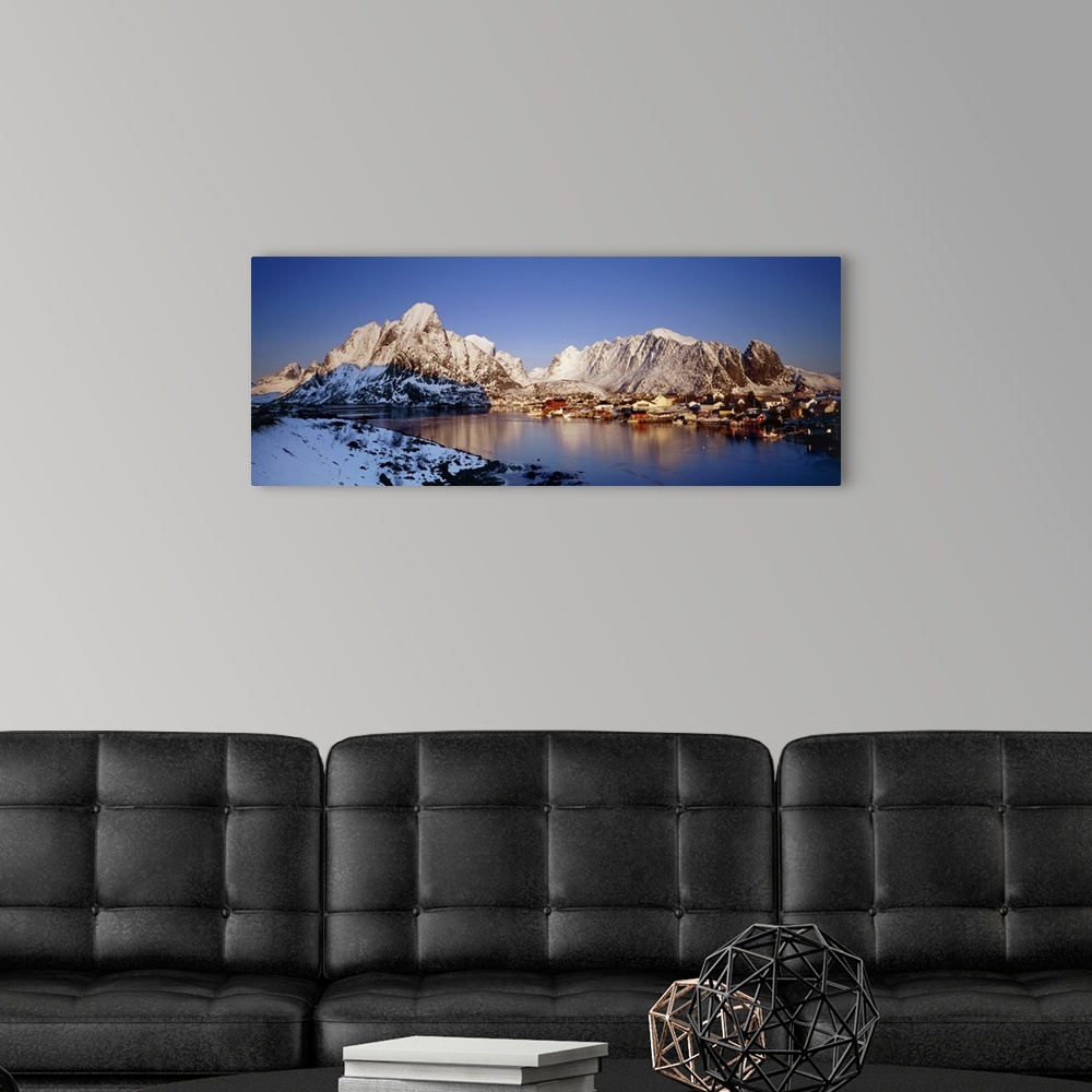 A modern room featuring Mountains along a sea side, Reine, Lofoten, Nordland County, Norway