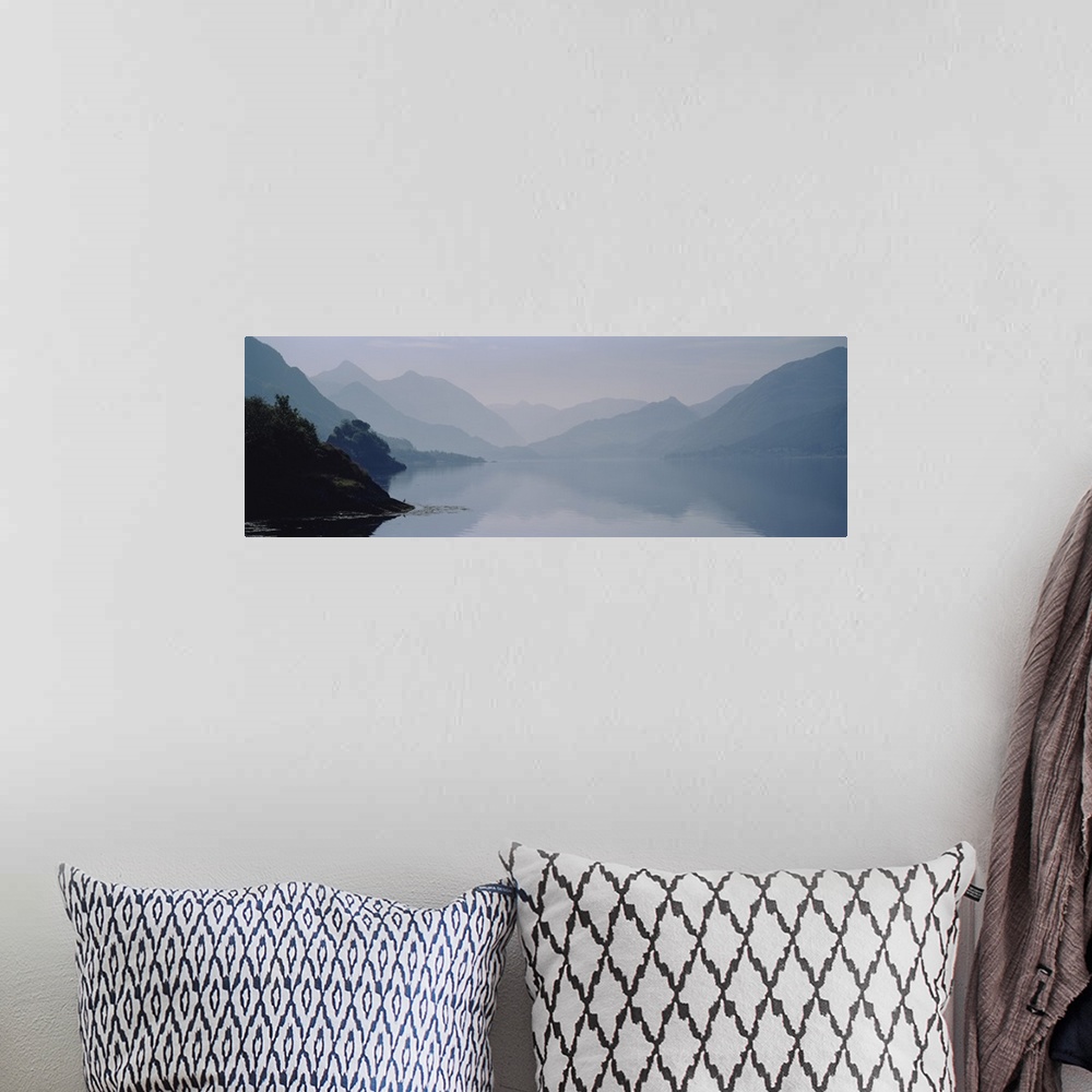 A bohemian room featuring Mountains covered with fog, Scotland