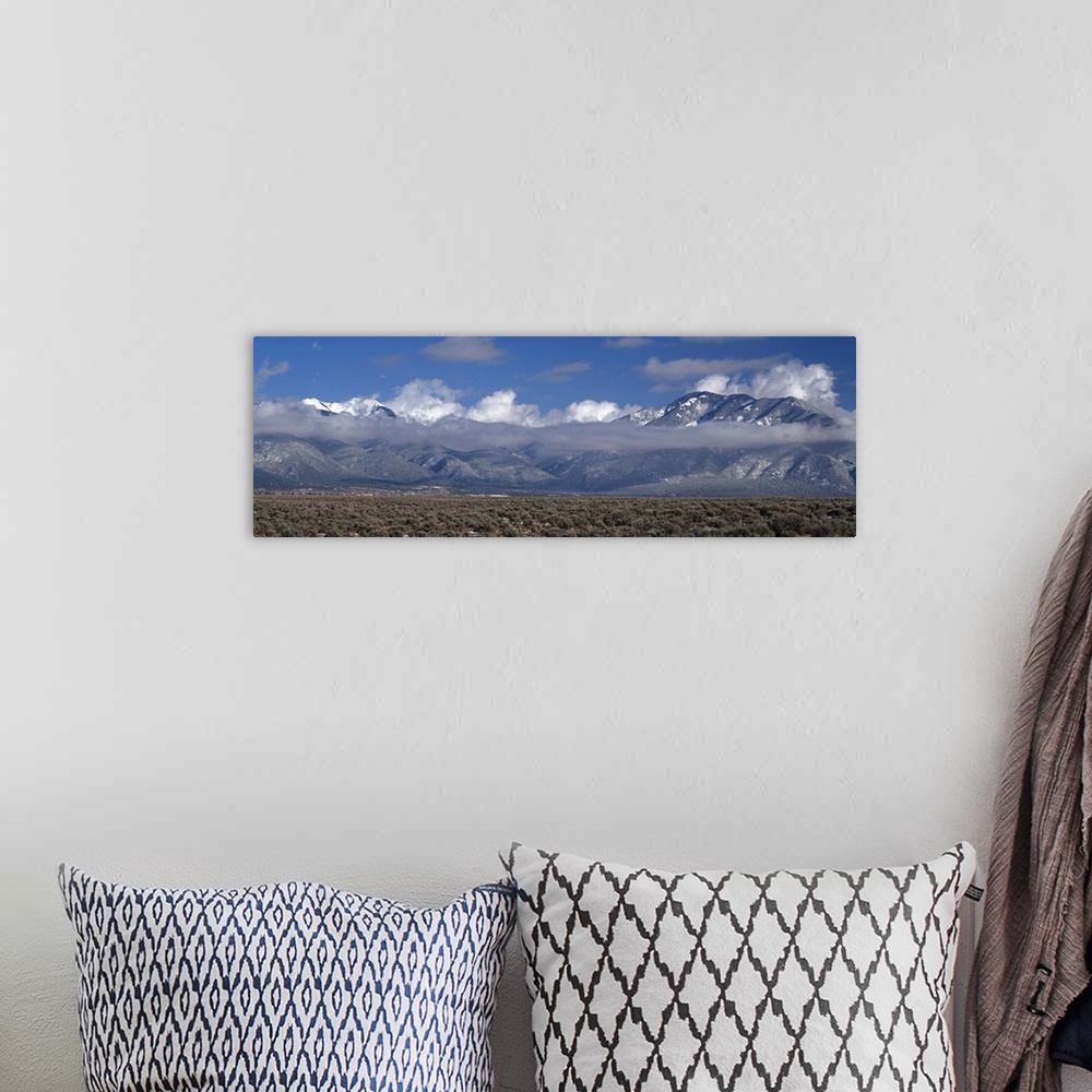 A bohemian room featuring Mountains covered with fog, Taos, New Mexico
