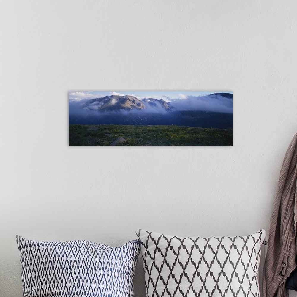 A bohemian room featuring Mountains surrounded by clouds, Rocky Mountain National Park, Colorado