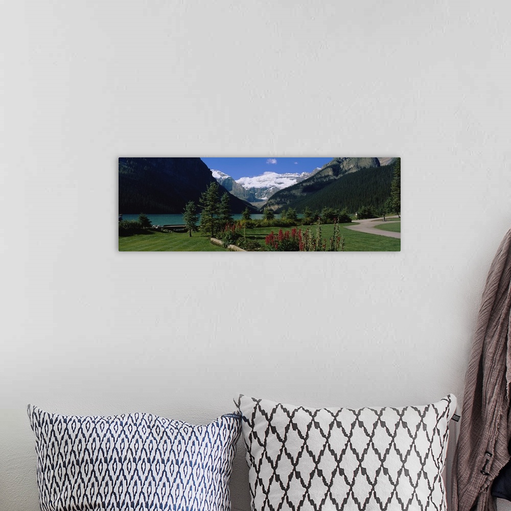 A bohemian room featuring Mountains surrounding a lake, Lake Louise, Canadian Rockies, Alberta, Canada