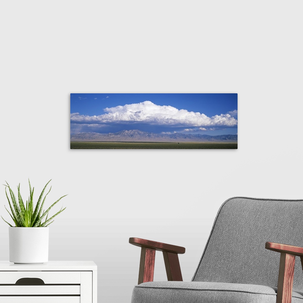 A modern room featuring Mountains w\ cumulus clouds NV