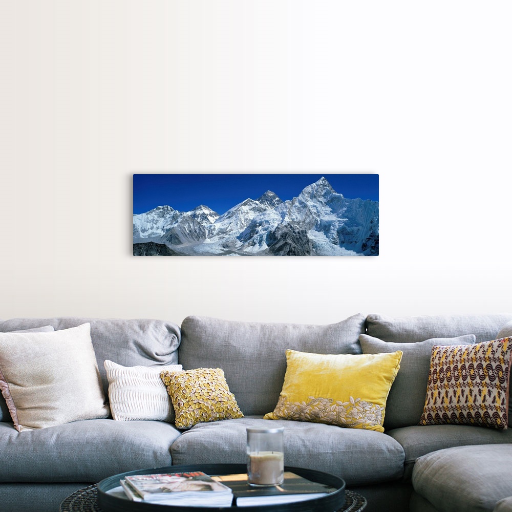 A farmhouse room featuring Giant, wide angle landscape photograph of snow covered Himalaya Mountains against a blue sky, inc...