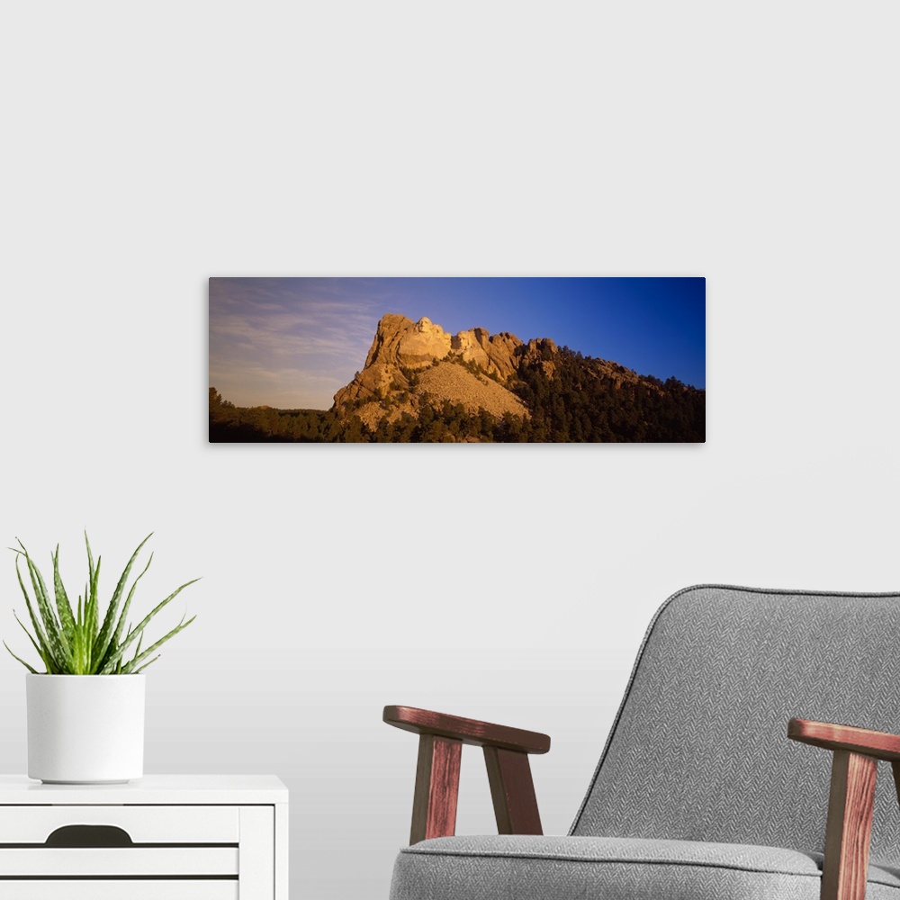 A modern room featuring Panoramic view of the granite sculpture, Mount Rushmore, in South Dakota.