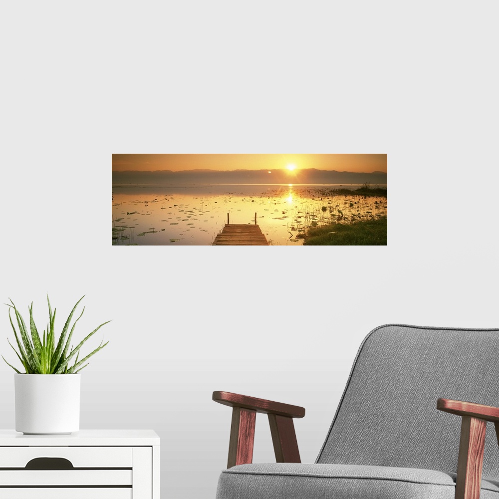 A modern room featuring Myanmar, Inle Lake, View of the sunset and pier