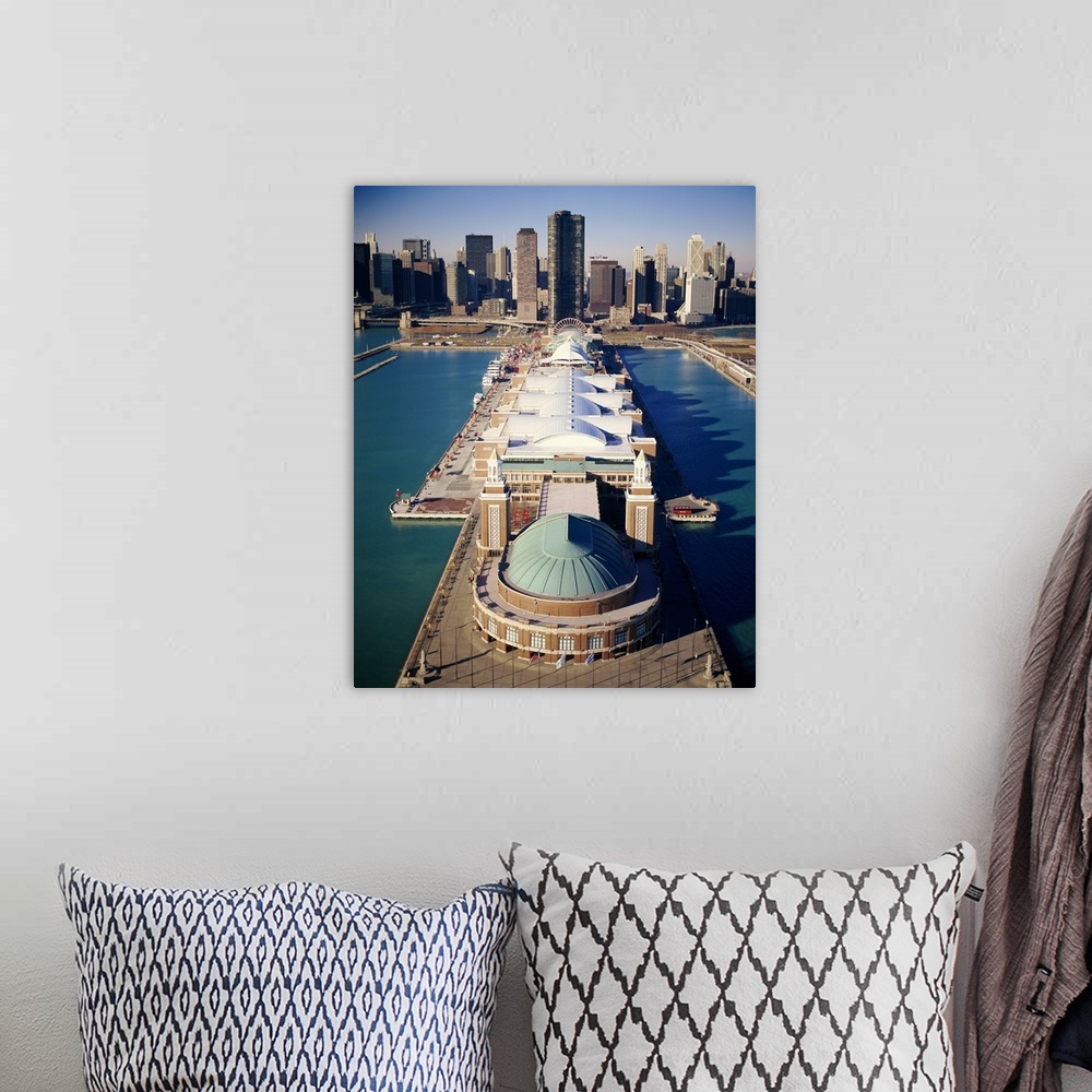A bohemian room featuring A vertical photograph of a pier that juts out into Lake Michigan with a large pavilion built on t...