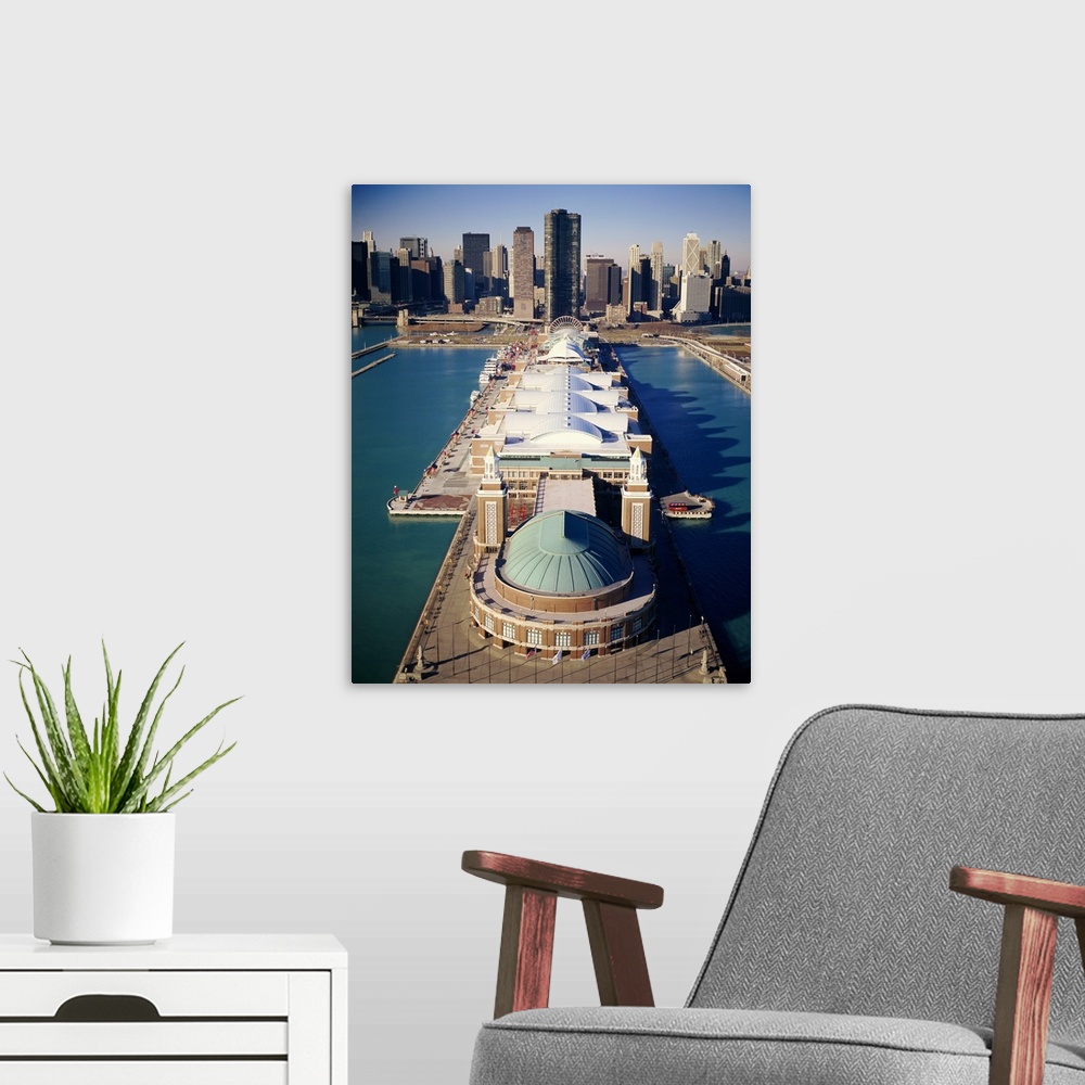 A modern room featuring A vertical photograph of a pier that juts out into Lake Michigan with a large pavilion built on t...