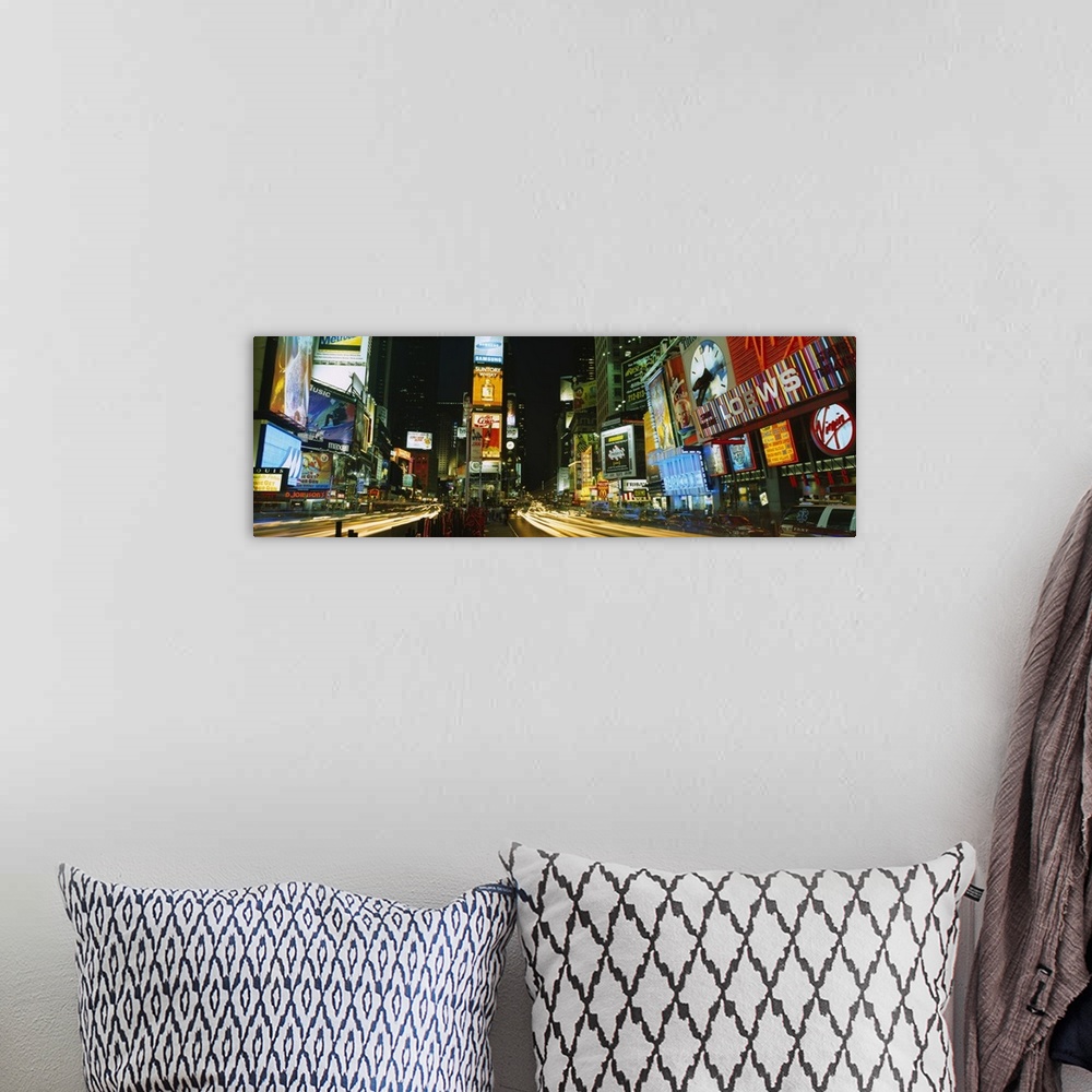 A bohemian room featuring Wide angle photograph of Times Square in New York City, brightly lit at night.