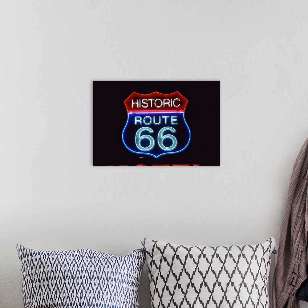 A bohemian room featuring Neon Route 66 Sign