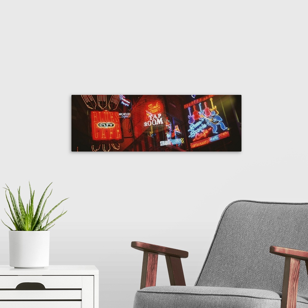 A modern room featuring Panorama of Memphis nightlife neon signs.