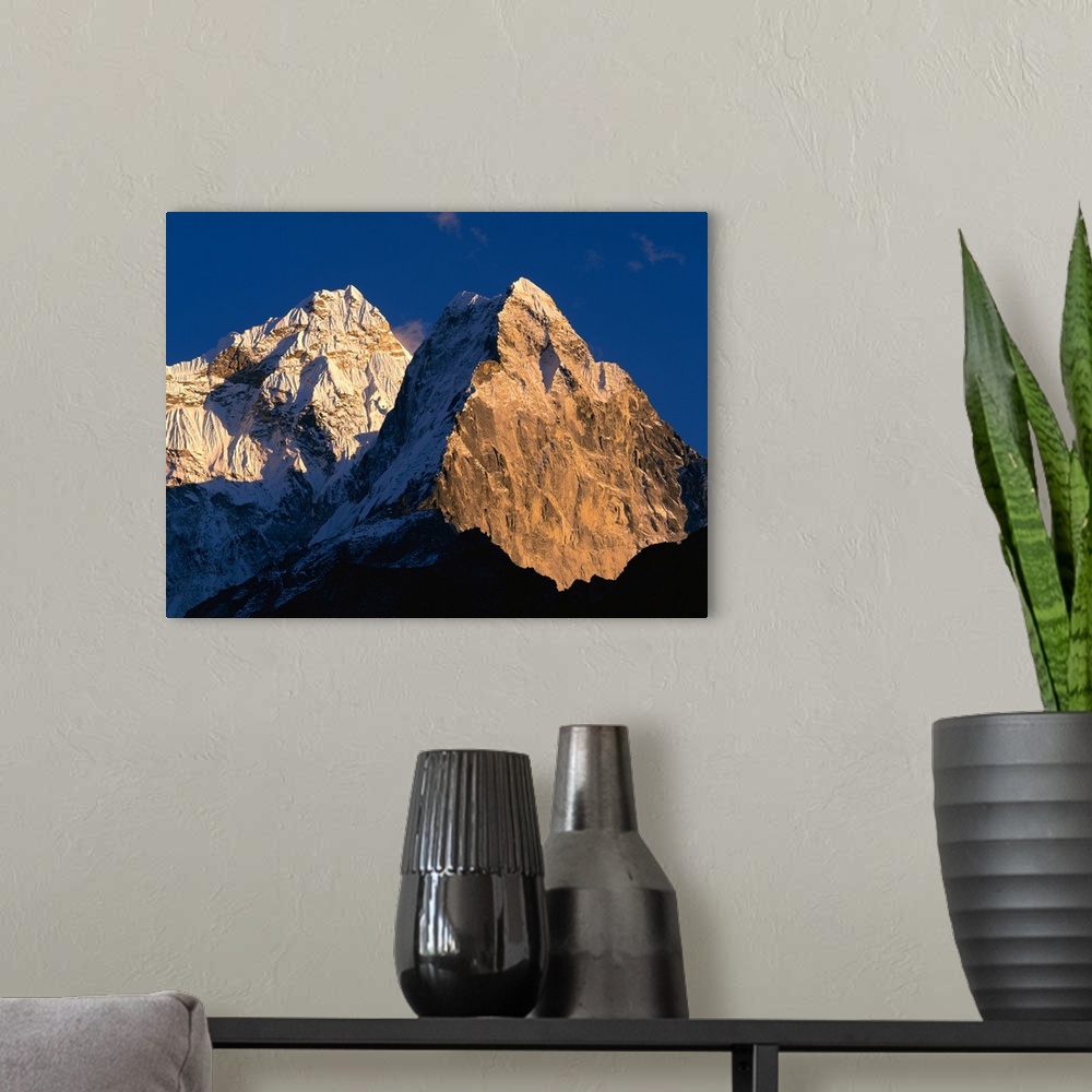 A modern room featuring Nepal, Ama Dablam, Sunlight over the mountain peak
