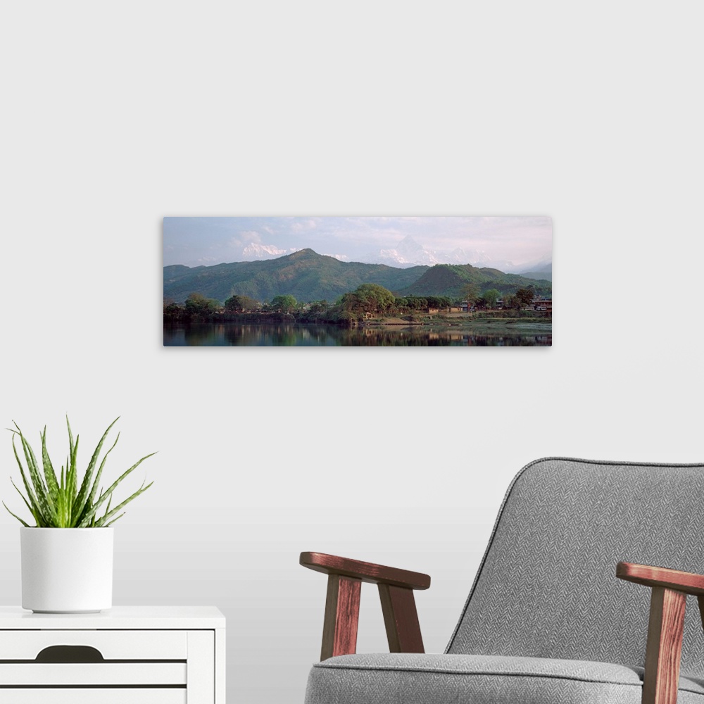 A modern room featuring Nepal, Pokora, Fishtail Mountains, Panoramic view of mountains around a lake